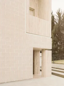 Modern concrete minimalist building exterior with vertical tile pattern