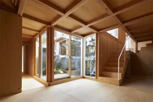 A modern residential space featuring wood trim and large windows