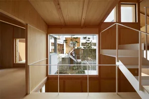 Modern residential interior with wooden panels and open space