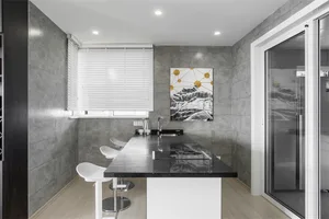 Minimalist kitchen featuring concrete countertops and minimalist design.