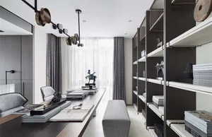 A modern, minimalist home office featuring black metallic accents and organized shelves.