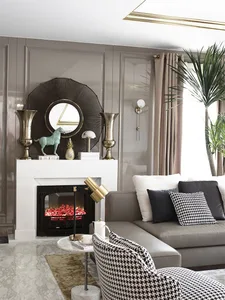 A modern living room with taupe-colored walls and a fireplace, featuring a corner sofa, decorative vases, and a large mirror.