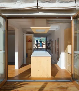 Modern living room with wooden floor and open-plan design
