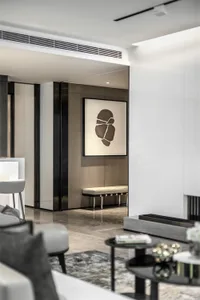 Modern interior design featuring marble surfaces, wooden panels, and metallic accents.