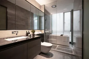 Modern minimalist bathroom featuring marble surfaces and a sleek, contemporary design.