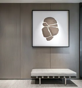 A modern piece of art featuring abstract patterns on a contemporary wooden wall.