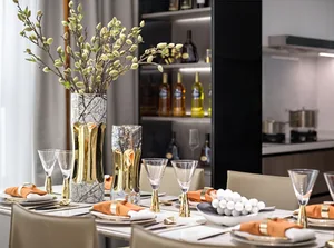 A modern dining room featuring marble and glass elements.