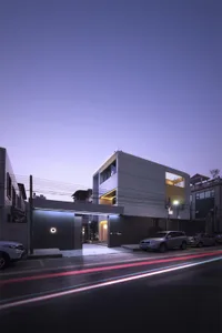 Modern building with concrete exterior and glass windows.