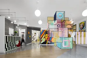 A vibrant, modern gallery interior featuring abstract art and geometric sculptures.