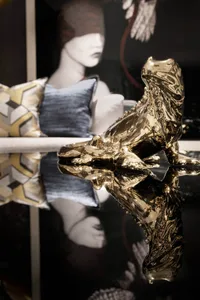 A modern interior design featuring gold decor elements