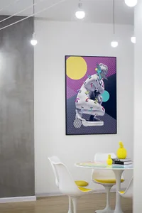 A contemporary art installation featuring a mixed-media piece on a wall in a modern studio or exhibition space.