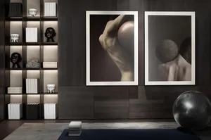 A modern yoga studio featuring wooden furnishings and abstract artwork.