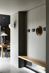 Industrial-style restaurant interior featuring concrete, wood, and metal elements.
