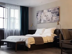 A modern bedroom with a brown bed in a minimalist style