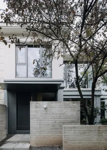 Modern house exterior with concrete walls and glass windows