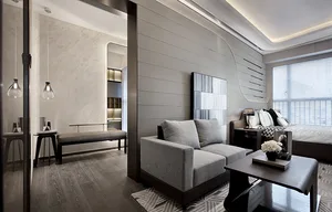 Modern minimalist living room with a grey fabric sofa, wooden flooring, and metal accents.