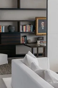 A modern interior featuring a white sofa with minimalist design.