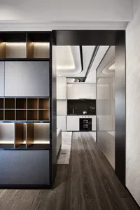 Modern residential kitchen featuring a white laminate countertop and black marble backsplash.