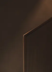 A minimalist door made of wood.