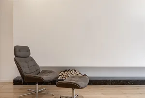 A modern interior design featuring a marble counter and wooden floor.