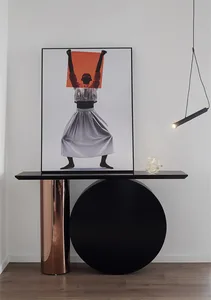 A striking metallic column console table with a circular base.