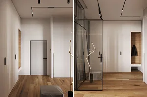 Modern minimalist hallway with glass doors and wooden floors, featuring sleek black accents and a stylish floor lamp.