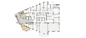 A detailed white paper showcasing a building's floor plan with various rooms and spaces.