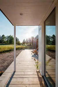 Modern exterior of a building with wood and glass materials.