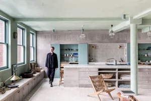 A modern kitchen with wooden cabinets and a large island.