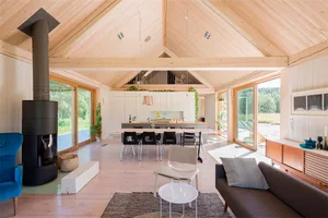 A modern living room featuring wooden floors and stylish furniture.