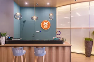 Modern wooden reception desk with glass top and metal legs