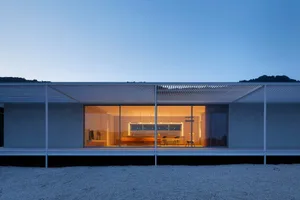 A modern residential interior featuring glass and wood materials.