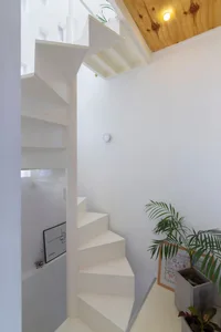 Modern interior design featuring a white staircase.