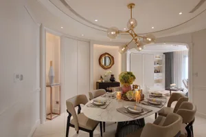 Modern dining room with marble table and glass chandelier
