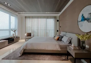 Modern bedroom with concrete floor, minimalist design, and large windows.