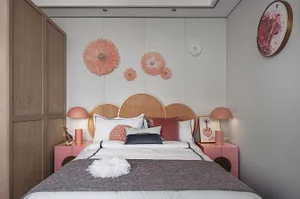 Modern bedroom featuring a wooden headboard, fabric bedding, and metal accents.