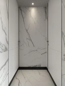 A modern bathroom with marble walls and floor.