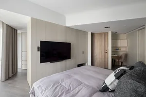A modern bedroom with a wooden bed frame
