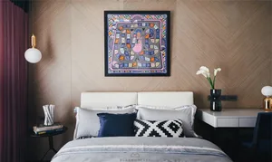 Minimalist bedroom with a white bed and colorful abstract painting above it.