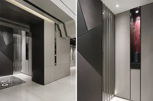 Modern entrance hall featuring metallic, glass, and marble materials.