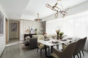 A modern dining room with a large white marble table surrounded by upholstered chairs, adorned with elegant tableware and dec