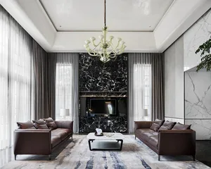 Modern living room featuring marble accent wall, concrete floor, and leather sofas.