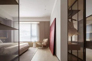 A modern minimalist bedroom with wooden furniture and a red artwork on the wall.