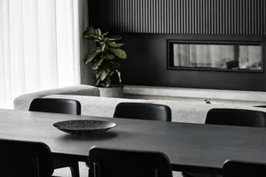 Modern dining room featuring a wooden dining table.