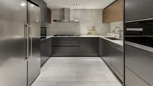 Modern kitchen with granite countertops and stainless steel appliances.
