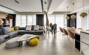 A modern living room with a sectional sofa, coffee table, and floor-to-ceiling windows, featuring a mix of wood and fabric el