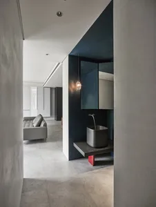 Modern minimalist interior with concrete and metal elements.