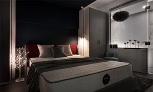 A modern bedroom featuring dark decor, a comfortable bed, and a sleek wardrobe.