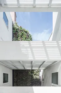 A modern interior with concrete and glass elements.