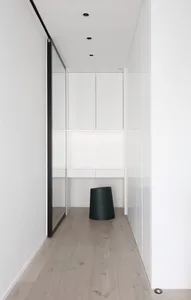 A well-lit, minimalist interior space featuring modern flat-pack cabinets.